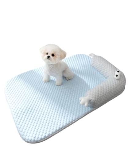 Soft blue pet cooling mat with an L-shaped bolster, providing comfort and support for pets during warm weather.